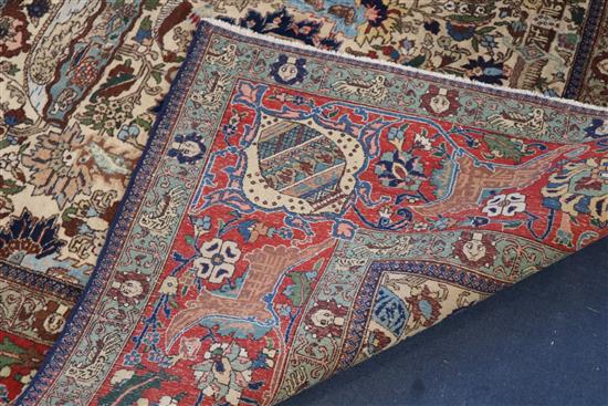 A Tabriz picture carpet, 10ft 11in by 8ft.